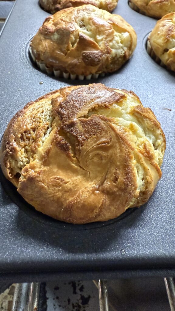 Pumpkin Cream Cheese muffins still in tin