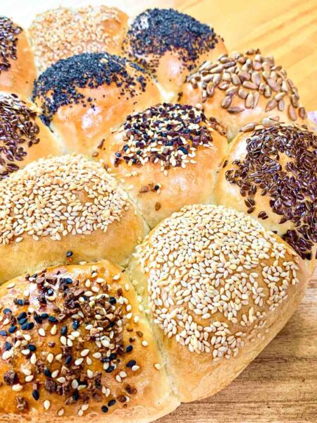 Bread roll wheel with different seeds on it like poppy seeds, flax seeds, sesame and everyting mix.