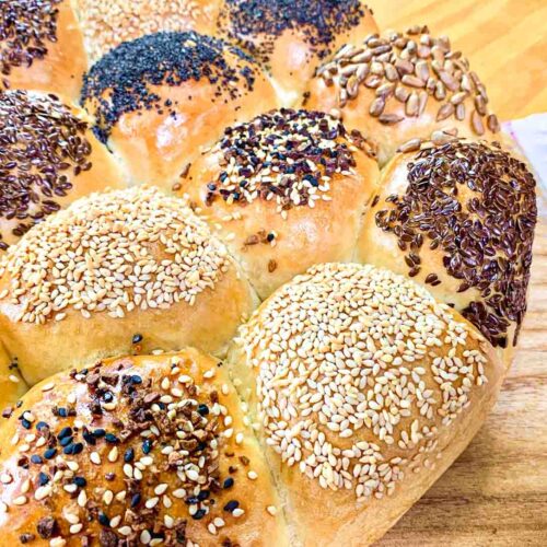 Bread roll wheel with different seeds on it like poppy seeds, flax seeds, sesame and everyting mix.