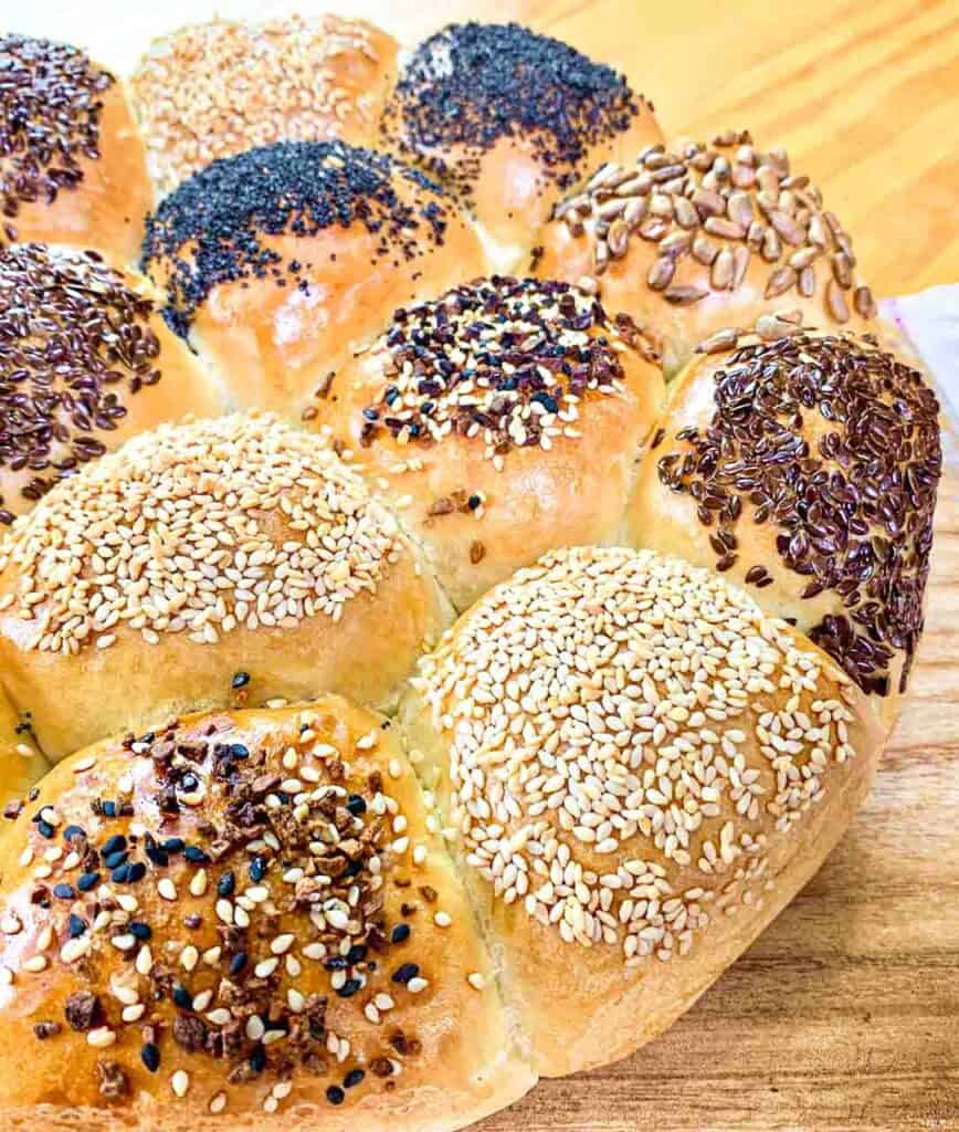 Bread roll wheel with different seeds on it like poppy seeds, flax seeds, sesame and everyting mix.