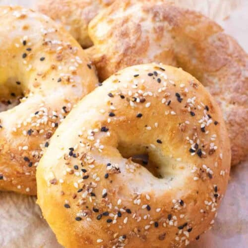 4 Healthy Greek Yogurt Protein Bagels on a plate with everything seasoning and cinnamon sugar.