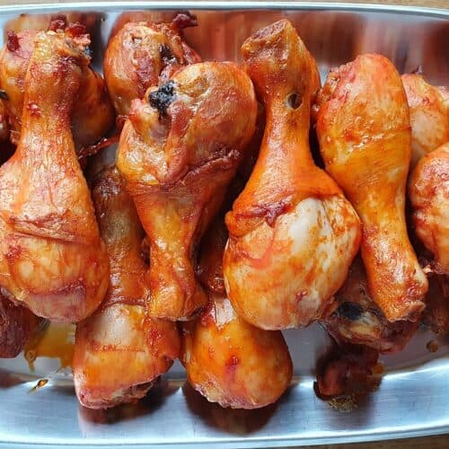 drumsticks cooked in air fryer on a metal plate