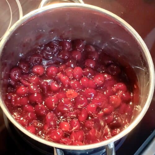 cherry pie filling in a stainless steel pot hot and ready