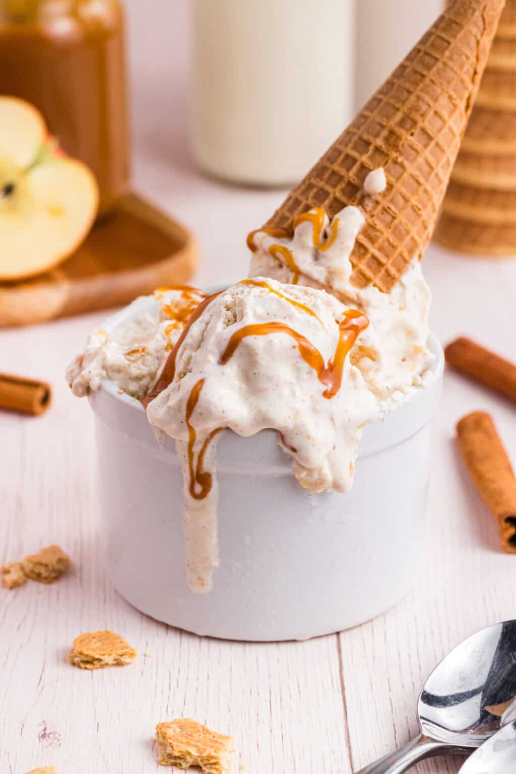 bowl of half melted Apple Pie Ice cream with a cone on top