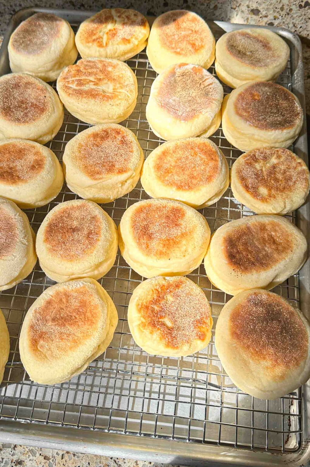 19 English Muffins on a cooling rack
