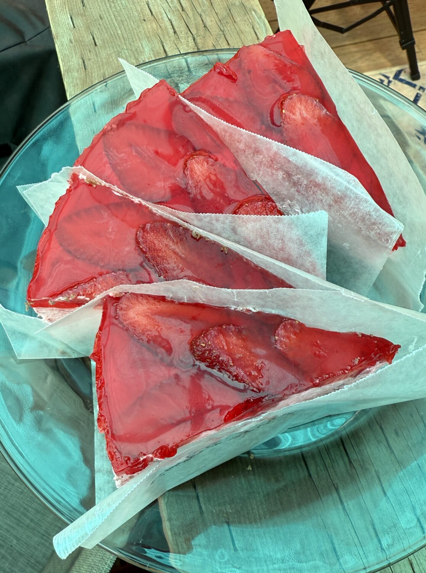 strawberry mousse cake slices frozen separately with wax paper in between