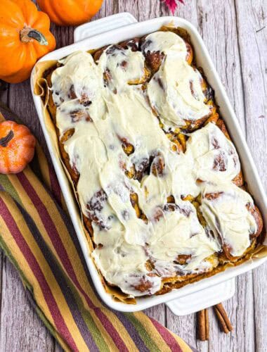 Cream Cheese Frosted Pumpkin Cinnamon Rolls in baking dish.