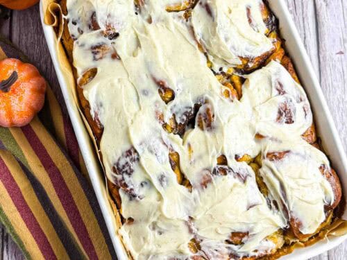 Cream Cheese Frosted Pumpkin Cinnamon Rolls in baking dish.