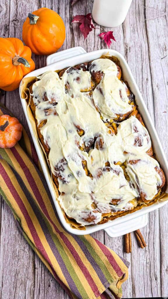 Cream Cheese Frosted Pumpkin Cinnamon Rolls in baking dish.