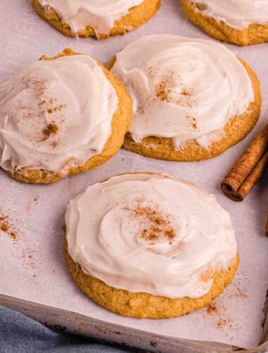 Pumpkin Cookies with cream cheese icing on a backing sheet