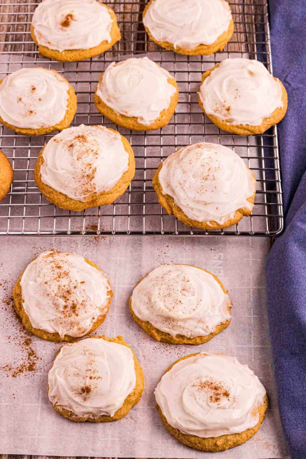 rack full of Pumpkin Cookies frosted with cream cheese frosting