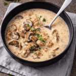 A bowl of homemade creamy mushroom soup