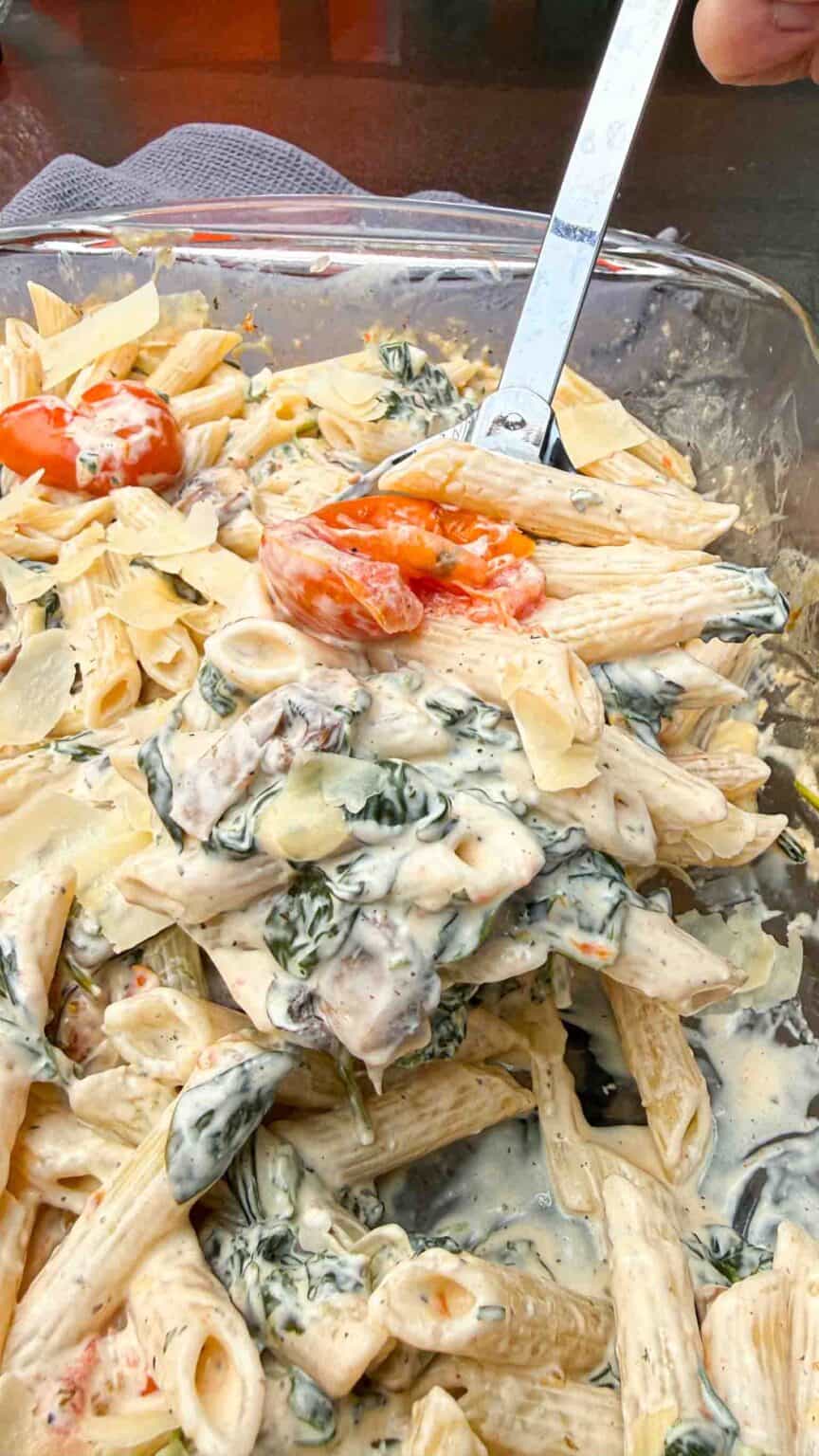 Boursin Spinach Pasta Casserole on a large spoon
