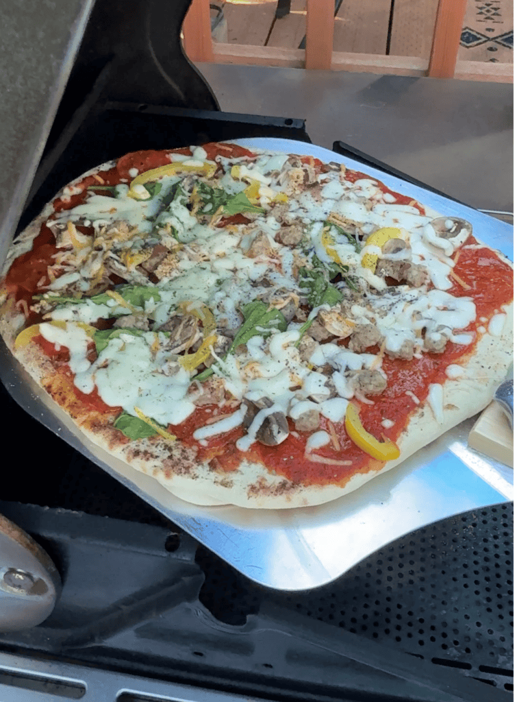 Pizza fresh from the grill and still hot and bubbling