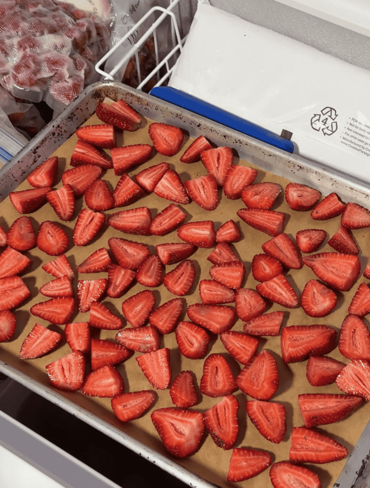 frozen straw on a baking sheet in the freezer