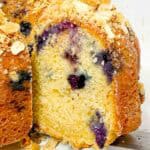 slice of blueberry bundt cake with oat crumble topping