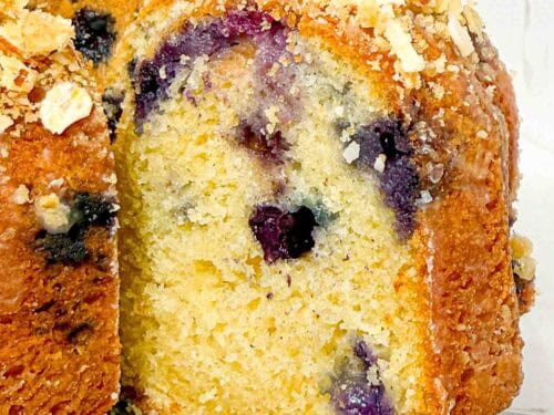 slice of blueberry bundt cake with oat crumble topping