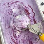 ice cream scoop in blueberry ice cream pan