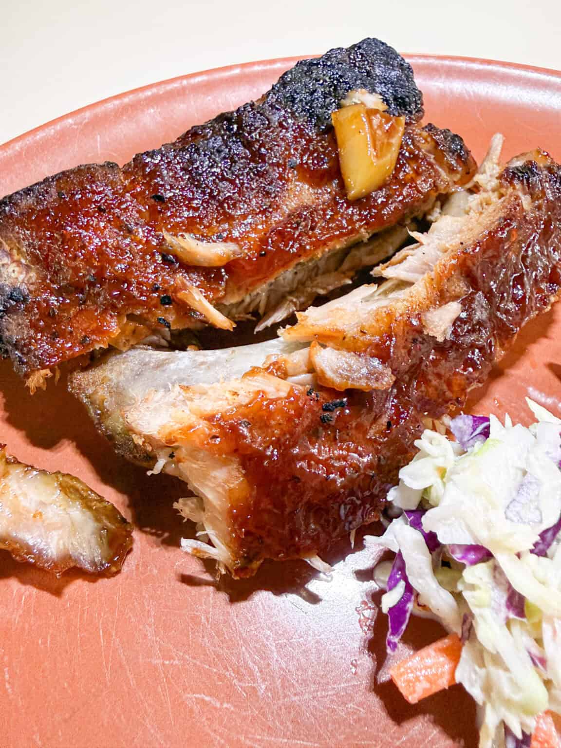 Fresh Broiled BBQ Ribs on a plate with cole slaw
