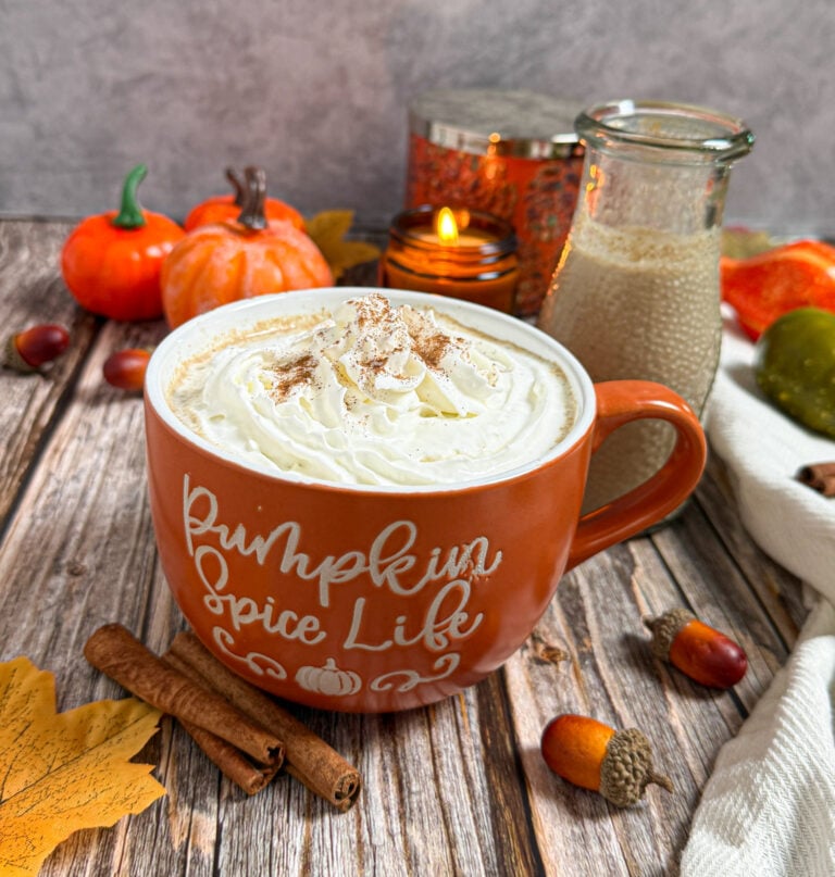 A muffin of fresh coffee with pumpkin spice creamer