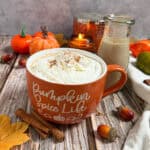 mug with hot coffee and pumpkin spice creamer