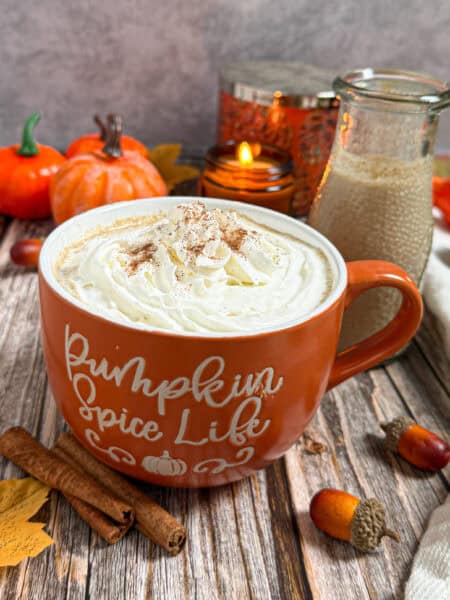 mug with hot coffee and pumpkin spice creamer