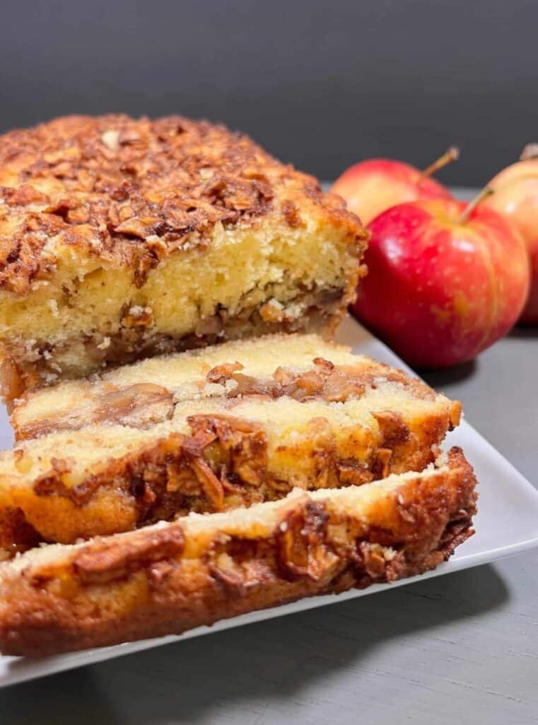 Apple Fritter Bread on a white tray cut in slices
